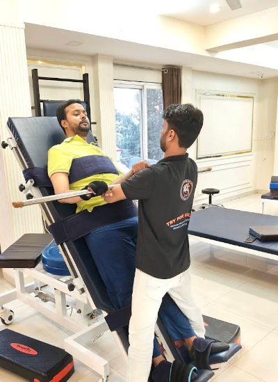 Physiotherapist helping patient walk